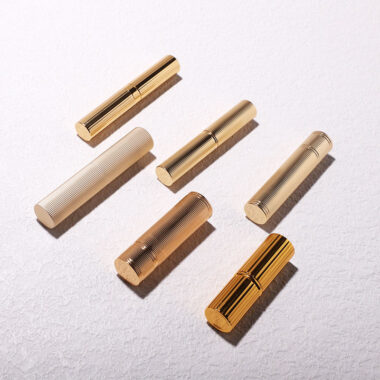 Round gold threaded lipstick tube for luxury beauty packaging